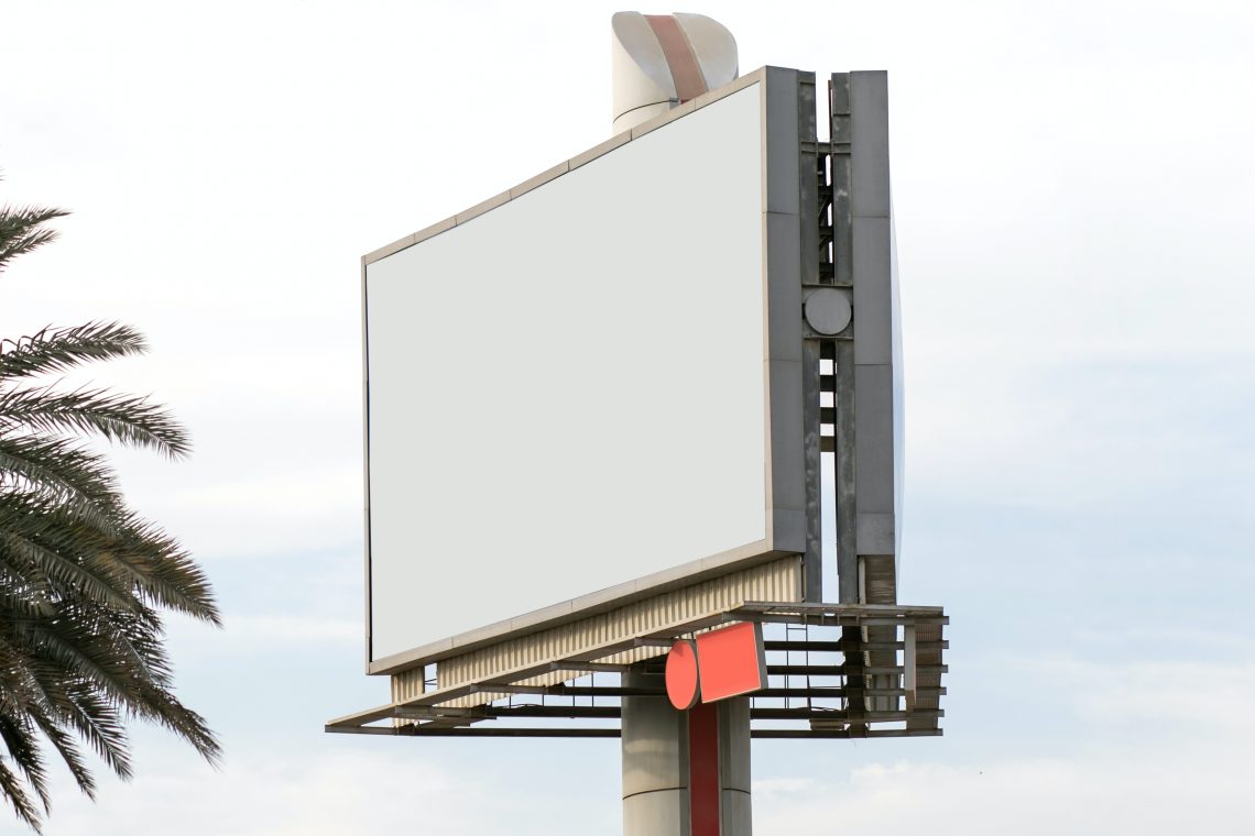 In the image, a blank billboard sits waiting - open for an advertising opportunity.