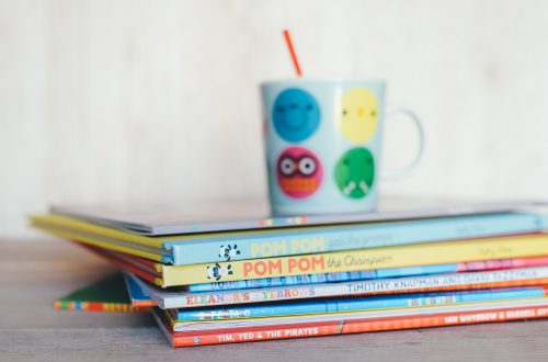 A stack of brightly colored children's books.