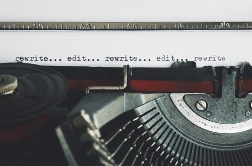 A close-up of a typewriter, this image evokes the feeling of self editing your novel, as the words "edit... rewrite... edit.... rewrite..." span the page.