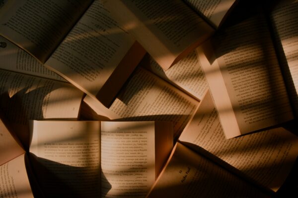 Multiple books layered one over the other.