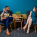 Two people sitting in chairs having a conversation
