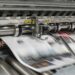 A printing press producing a page.
