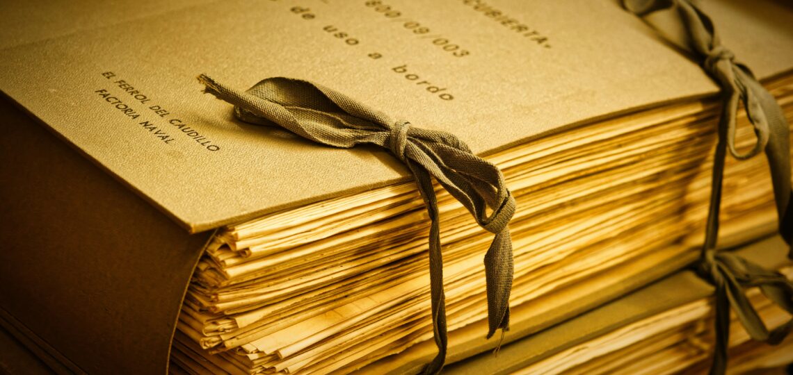 A stack of papers (a manuscript) tied together with string.