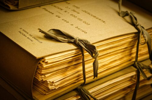 A stack of papers (a manuscript) tied together with string.